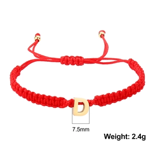 Detail of red braided rope bracelet with a 7.5mm gold letter D pendant and beads