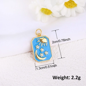Macro detail of blue enamel pendant with gold sun, moon, stars and size measurements