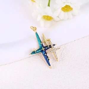 Macro view of blue enamel star pendant with gold plating and white zircon inlay