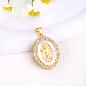 Detail showing cross pendant in gold finish with white shell inlay and zircons