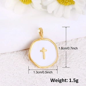 Macro detail of a 1.8cm gold-plated cross pendant with white enamel and size markings