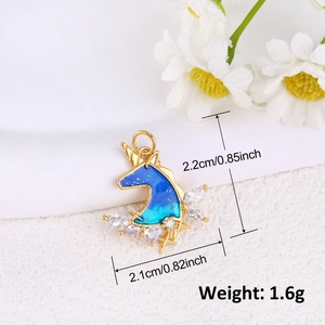Macro view of blue enamel unicorn pendant with zircon stones and dimensions 2.2x2.1cm