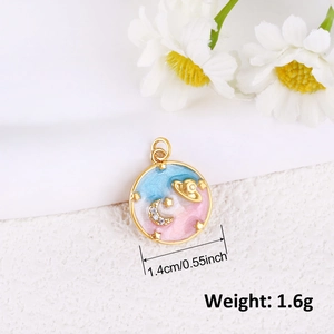 Detail of 1.4cm gold plated universe pendant with blue enamel and zircon moon star