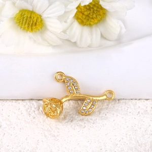 Detailed view of gold-plated rose charm with sparkling rhinestones for jewelry making