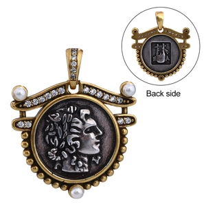 Detail shot of vintage Greek coin pendant with portrait relief and luther back