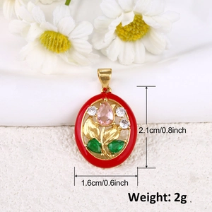 Detail view of gold-plated tulip pendant with dimensions 2.1cm by 1.6cm and red enamel