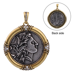 Detail of vintage coin pendant featuring goddess relief with crystal-set golden border
