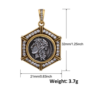 Detailed view of a gold hexagonal coin pendant with silver goddess relief and crystals