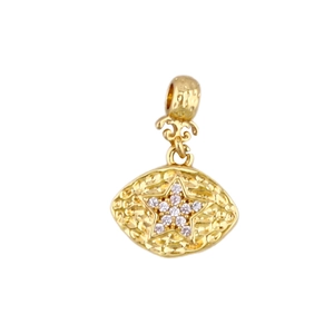 Macro detail of gold plated star pendant with sparkling cubic zirconia inlay