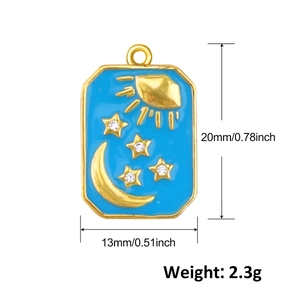 Detail of blue rectangular pendant with gold moon and star patterns for DIY jewelry