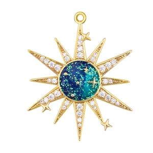 Macro view of gold-plated octagonal star pendant with gradient blue center and tiny zircons