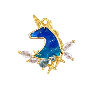 Macro view of gold-plated unicorn pendant with blue enamel and sparkling zircon accents
