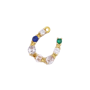 Macro detail of horseshoe charm with multicolored zirconia stones in gold plating