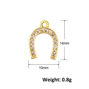 Detailed view of 14x10mm gold horseshoe pendant with micro-set white cubic zirconia stones