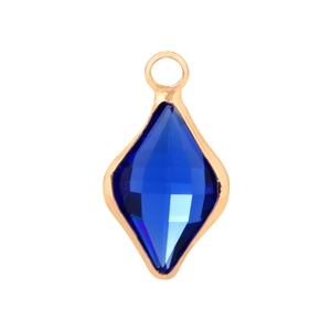 Detail view of rhombic gold-plated pendant with deep blue faceted glass crystal