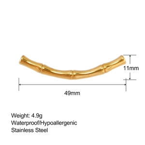Detailed view of bamboo joint gold tube pendant with 49mm length and 11mm width dimensions