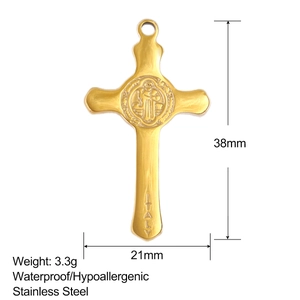 Macro detail of gold stainless steel cross pendant with St. Benedict crest and Italy stamp