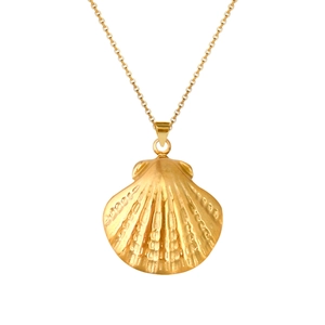 Macro detail of a polished gold shell pendant necklace with a delicate chain link