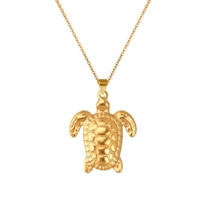 Detail of a golden sea turtle necklace pendant with intricate shell patterns on a slim chain