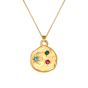 Detail of gold coin necklace pendant with hammered texture and colorful rhinestones