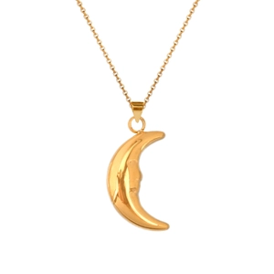 Detailed view of the gold crescent moon face pendant on a vintage steel necklace chain