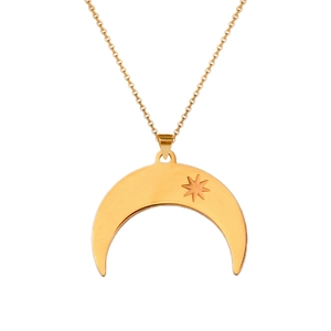 Detail of gold crescent moon pendant with engraved star on polished link chain