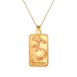 Macro detail of gold tarot star pendant with moon relief and sparkling crystals