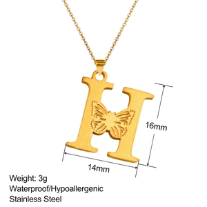 Close-up of 18K gold stainless steel letter H pendant with butterfly cutout design