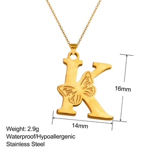 Macro view of 18K gold letter K pendant with butterfly engraving and size specs