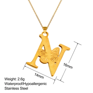 Macro detail of 18K gold letter N butterfly pendant with 16mm height and 14mm width
