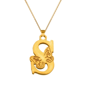 Macro detail of 18K gold butterfly necklace pendant featuring a polished letter S design