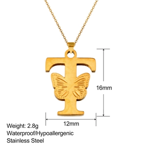 Detail of 18K gold letter T pendant with butterfly carving and dimensions on white background