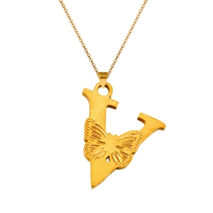 Macro shot of gold-plated letter V pendant with detailed butterfly relief on a link chain
