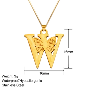 Detail of 18K gold stainless steel pendant with letter W and butterfly relief design