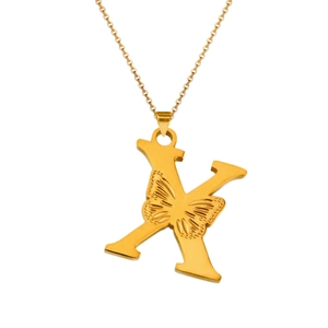 Detailed macro view of 18K gold letter K pendant with hollow butterfly engraving
