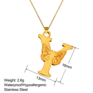 Macro shot of 18K gold plated stainless steel letter Y pendant with butterfly engraving