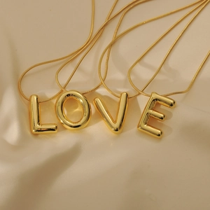 Golden 3D balloon alphabet pendant necklace set with LOVE letters on beige silk