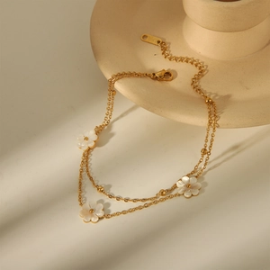 Elegante tobillera de doble capa en acero inoxidable chapado en oro de 18K con flores de margaritas