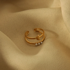 Detail of 18K gold-plated double-layer ring featuring a crescent moon and pearls