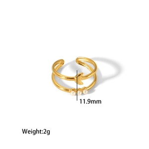 Detail shot of 18K gold plated stainless steel ring with moon charm and pearls