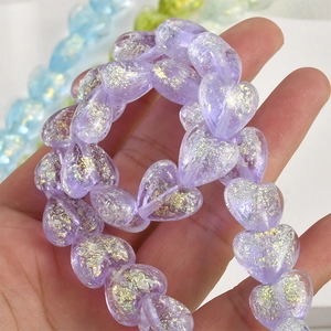 Translucent heart-shaped beads with iridescent gold foil flakes for DIY jewelry making