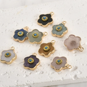 Natural crystal flower pendants with gold plated edges in various colors and gemstones