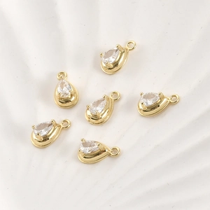 Macro shot of 14k gold-plated pear-shaped zircon pendants for DIY jewelry making
