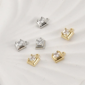 Macro shot of 14k gold and silver plated square zircon charms for DIY jewelry making