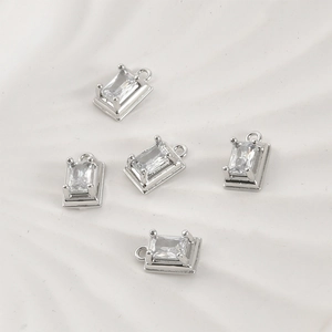 Close-up of rectangle zircon pendants with silver finish for DIY jewelry crafting