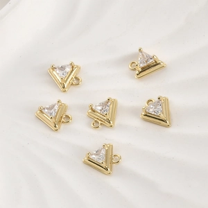 Detail of 14k gold plated triangle pendants with clear cubic zirconia for DIY jewelry
