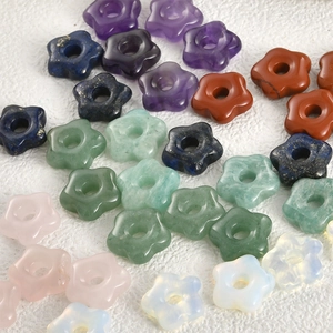 Macro view of multi-color natural crystal stone flower beads with center drill holes