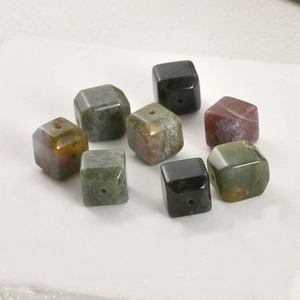 Macro detail of natural cube stone beads with pre-drilled holes for DIY jewelry making