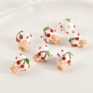 Handmade glass cupcake beads with red cherries and green leaves for DIY jewelry making