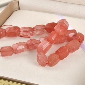 Macro shot of faceted strawberry quartz rectangular beads for DIY jewelry making